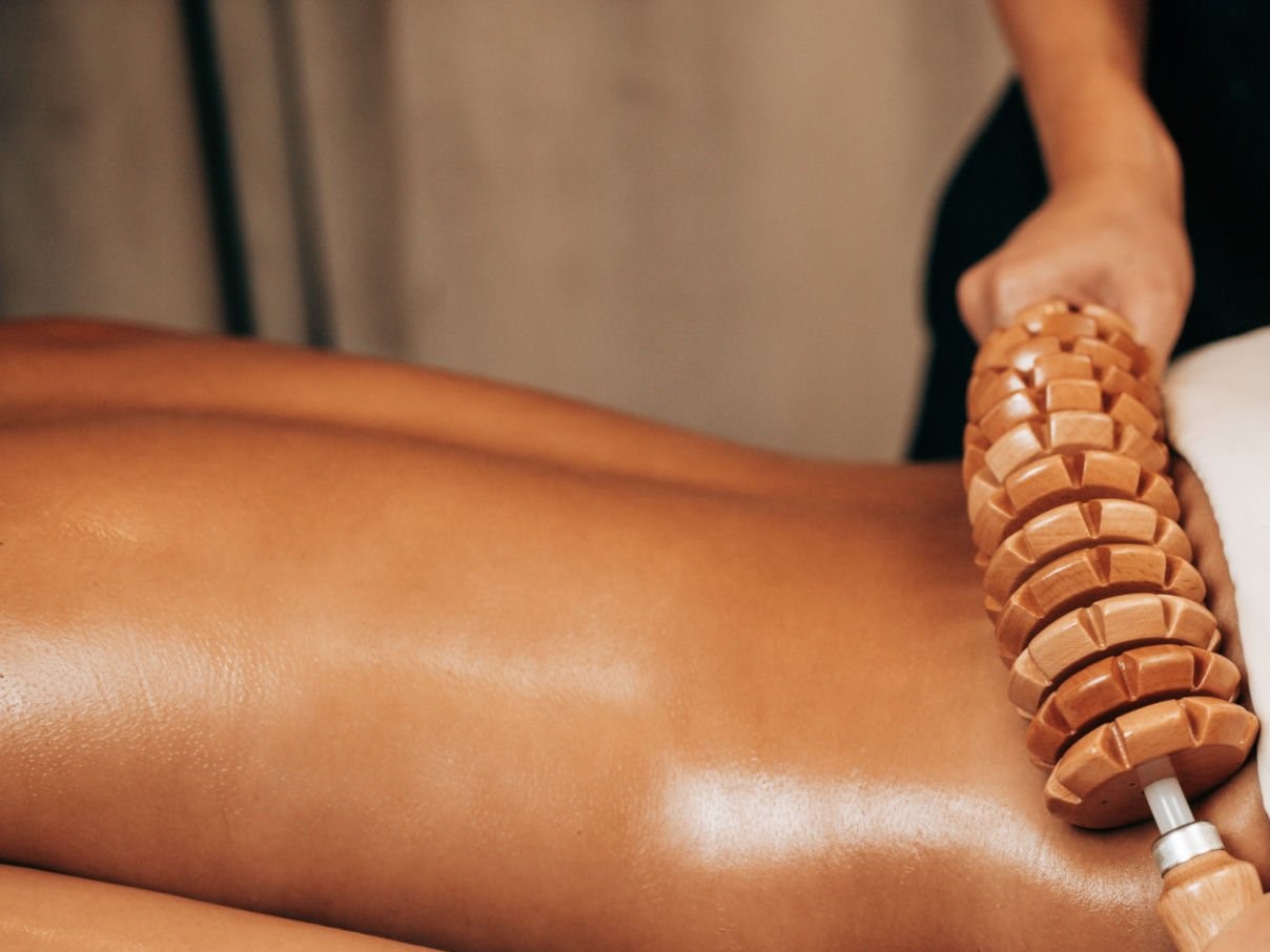 Woman on anti cellulite massage treatment. Madero therapy. Woman on anti cellulite massage treatment. Madero therapy.